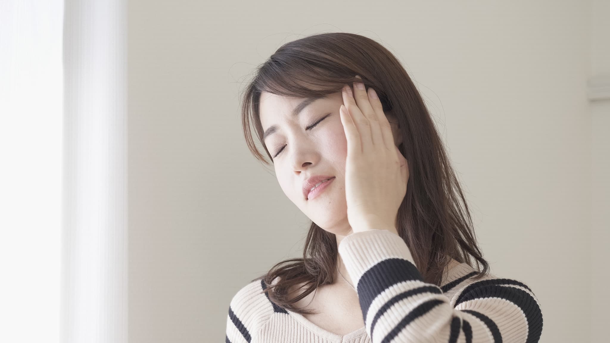 セラミック治療後に歯が痛くなってきた女性